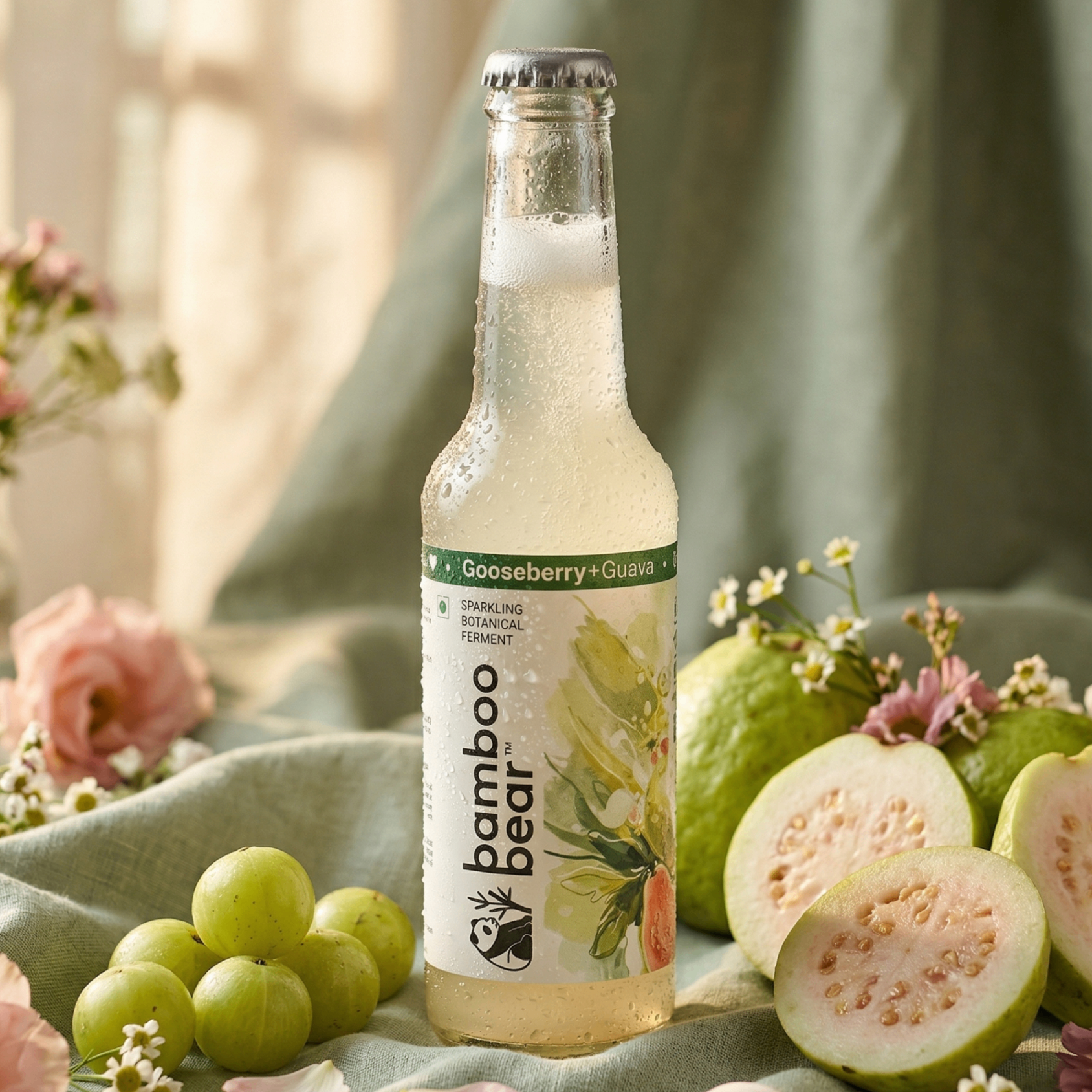 Bamboo Bear Gooseberry and Guava bottle with fresh gooseberries and guava slices.